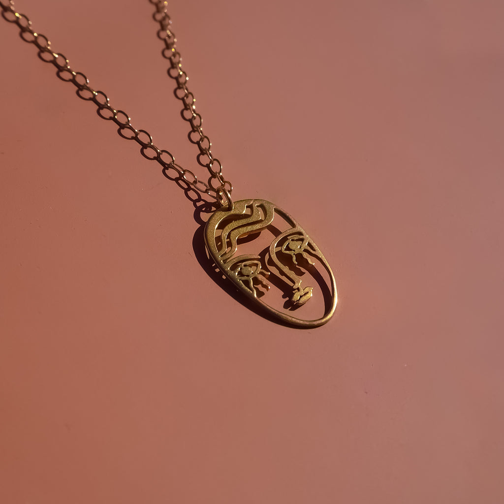 Gold Plated Face necklace